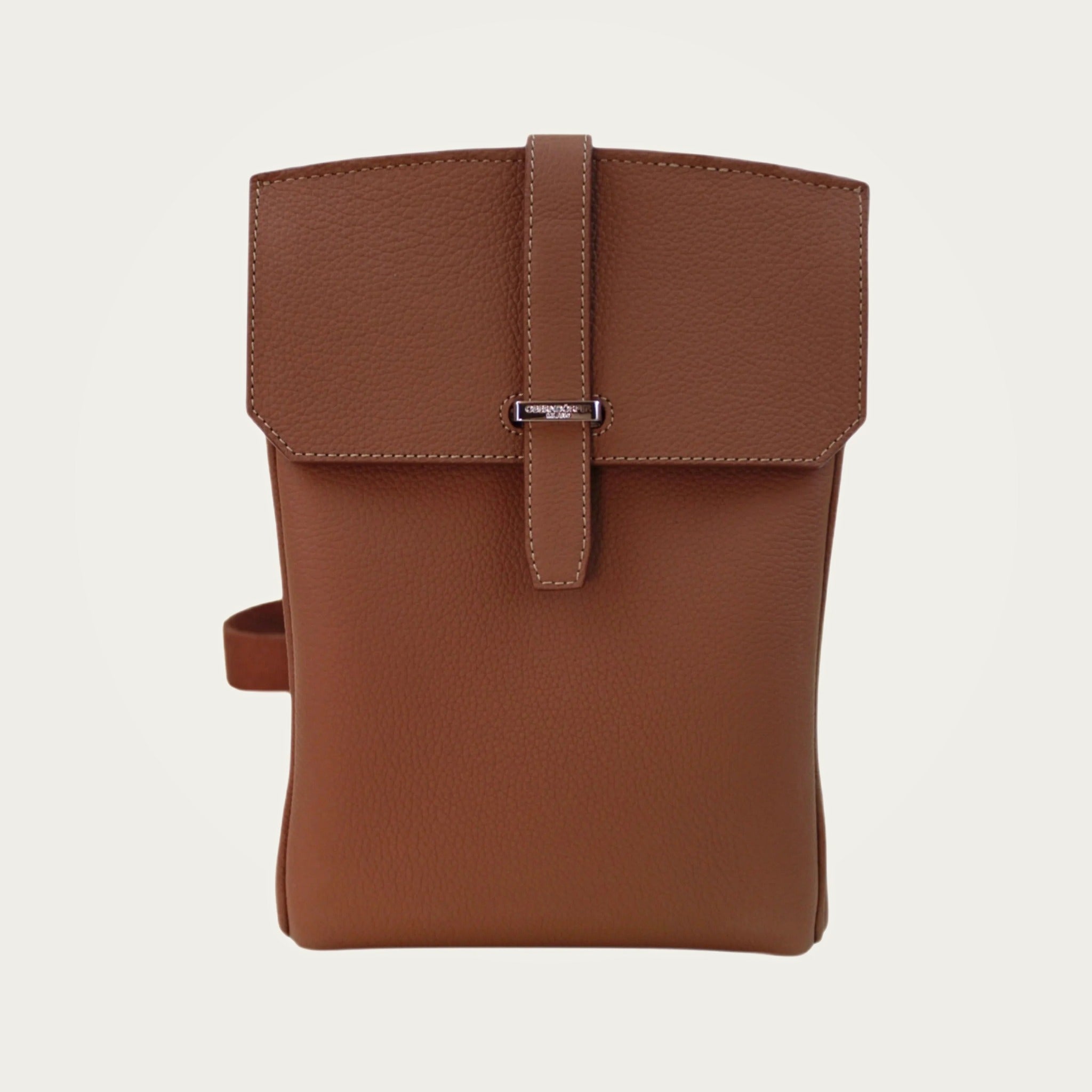 SAC in brown Togo leather on an ivory studio ground