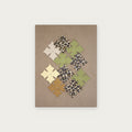 Wall Art No. 34, Taupe – leather crosses on taupe microfiber, 40 × 30 cm