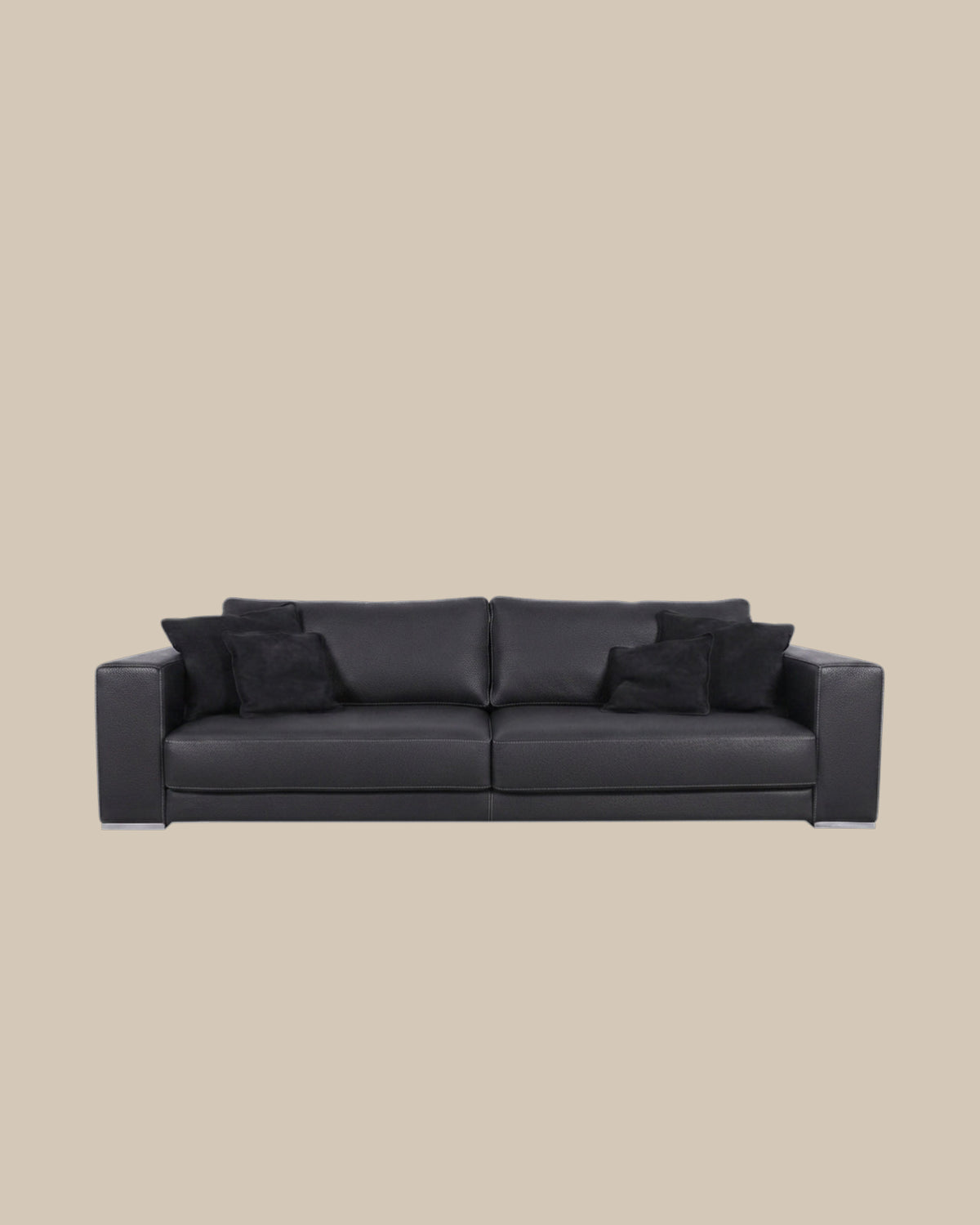 Black Italian leather sofa on a warm beige ground - Oberndörfer Milano
