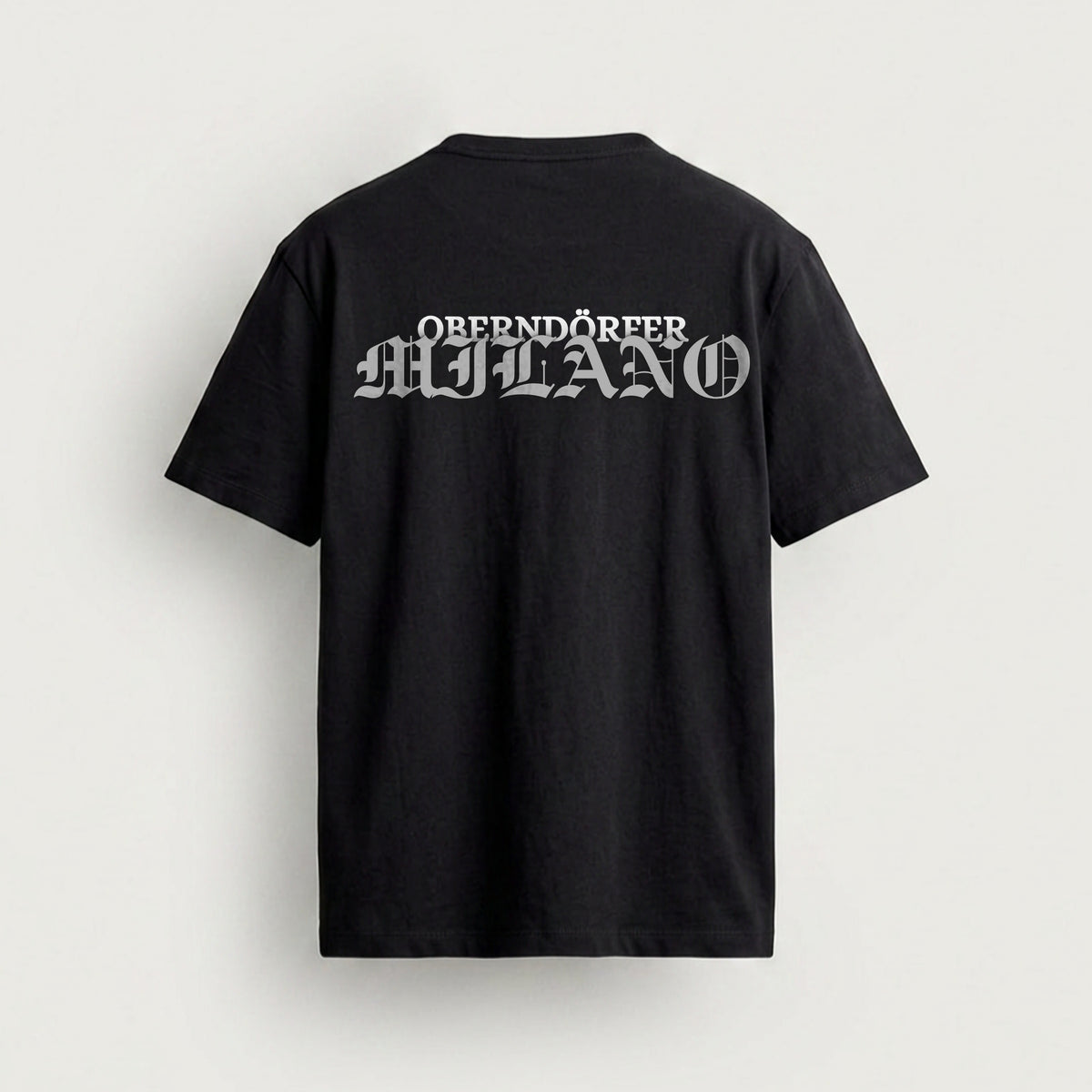 T-Shirt OBERNDÖRFER MILANO in black, back, chrome blackletter across the shoulders