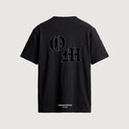 The Initials T-Shirt in black, back, interlocking O and M outlined in blackletter