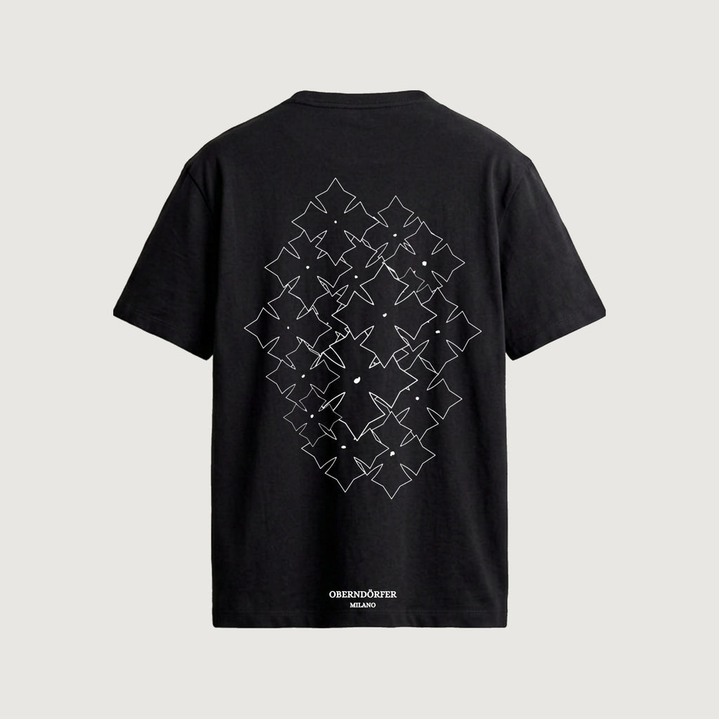 The Lattice T-Shirt in black, back, star repeated in white outline across a diamond field