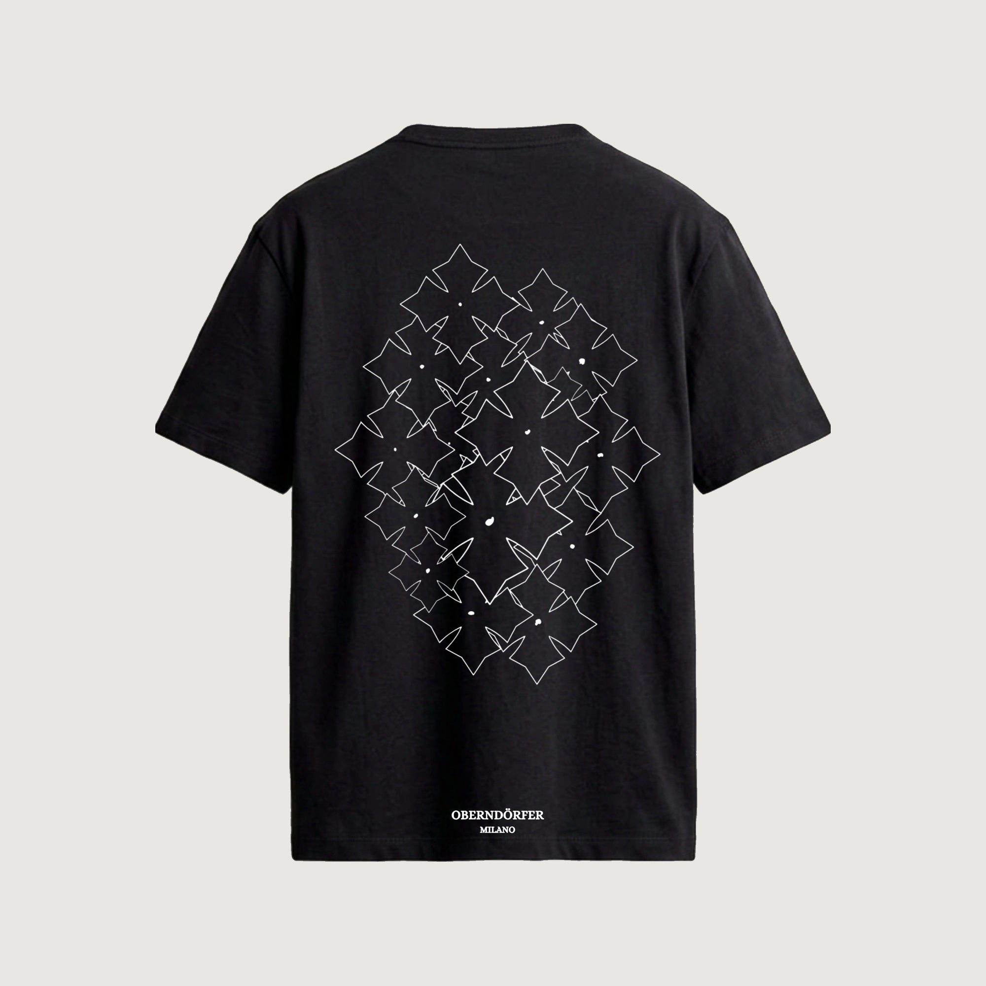 The Lattice T-Shirt in black, back, star repeated in white outline across a diamond field