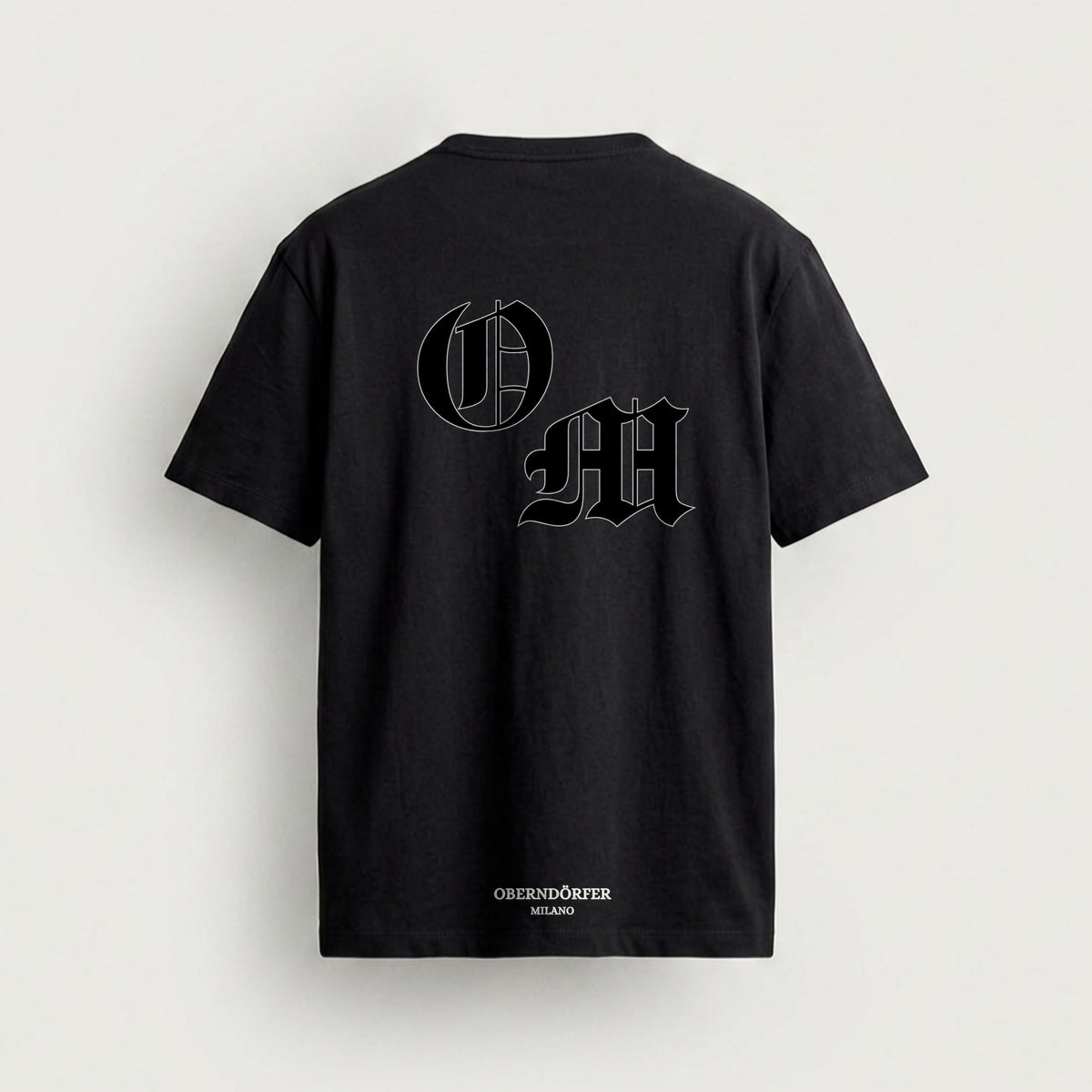 T-Shirt OM in black, back, interlocking O and M in blackletter